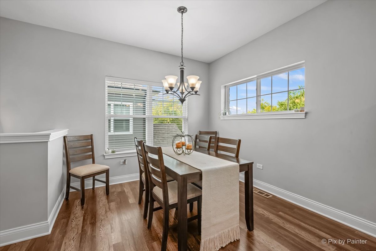 745 Harper Avenue Cary, IL 60013 - Photo 11 of 32 a view of a dining room with furniture window and outside view
