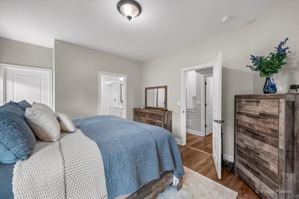 745 Harper Avenue Cary, IL 60013 - Photo 13 of 32 a bed room with a bed and a television