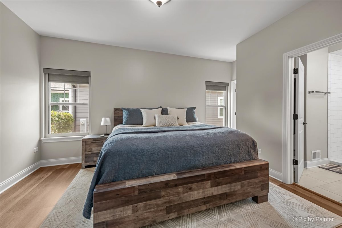 745 Harper Avenue Cary, IL 60013 - Photo 14 of 32 a bedroom with a bed and a window