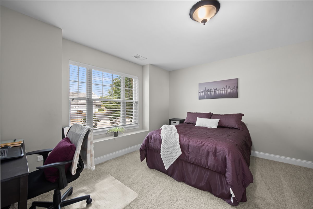 745 Harper Avenue Cary, IL 60013 - Photo 20 of 32 a bed room with a bed and a chair