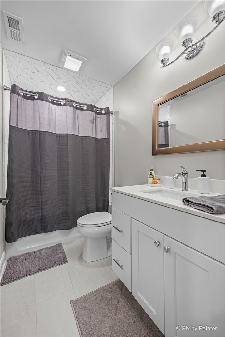 745 Harper Avenue Cary, IL 60013 - Photo 23 of 32 a bathroom with a sink a toilet and shower
