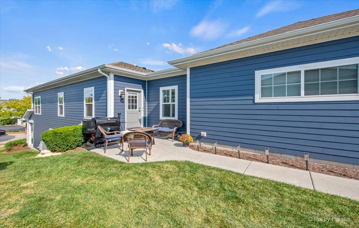 745 Harper Avenue Cary, IL 60013 - Photo 3 of 32 a view of a house with backyard sitting area and garden