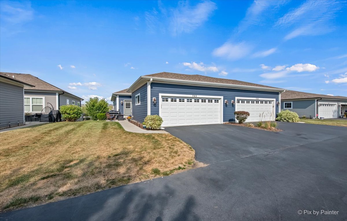 745 Harper Avenue Cary, IL 60013 - Photo 31 of 32 a front view of a house with a yard