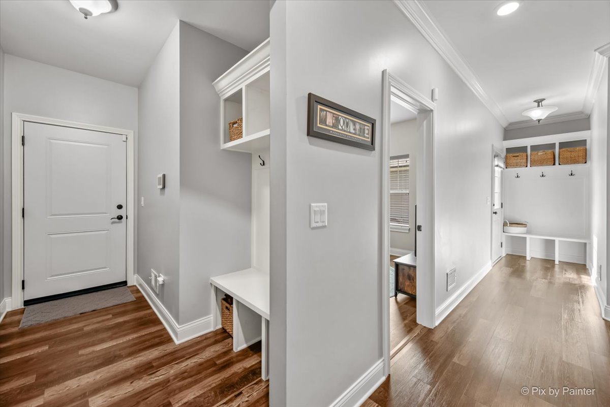 745 Harper Avenue Cary, IL 60013 - Photo 4 of 32 a view of a hallway with wooden floor and closet
