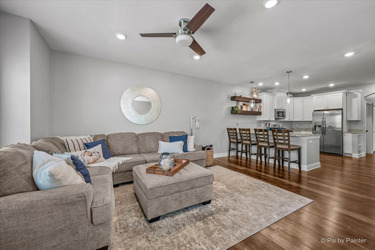 745 Harper Avenue Cary, IL 60013 - Photo 8 of 32 a living room with furniture and kitchen view