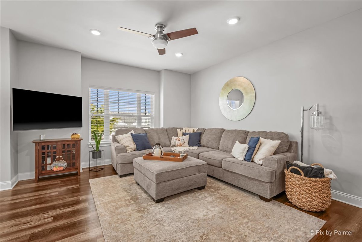745 Harper Avenue Cary, IL 60013 - Photo 9 of 32 a living room with furniture and a flat screen tv