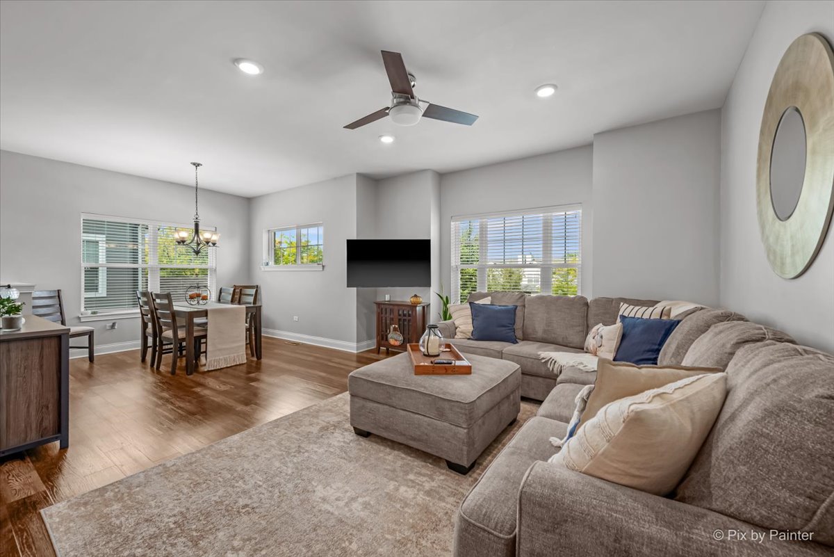 745 Harper Avenue Cary, IL 60013 - Photo 10 of 32 a living room with furniture and a flat screen tv