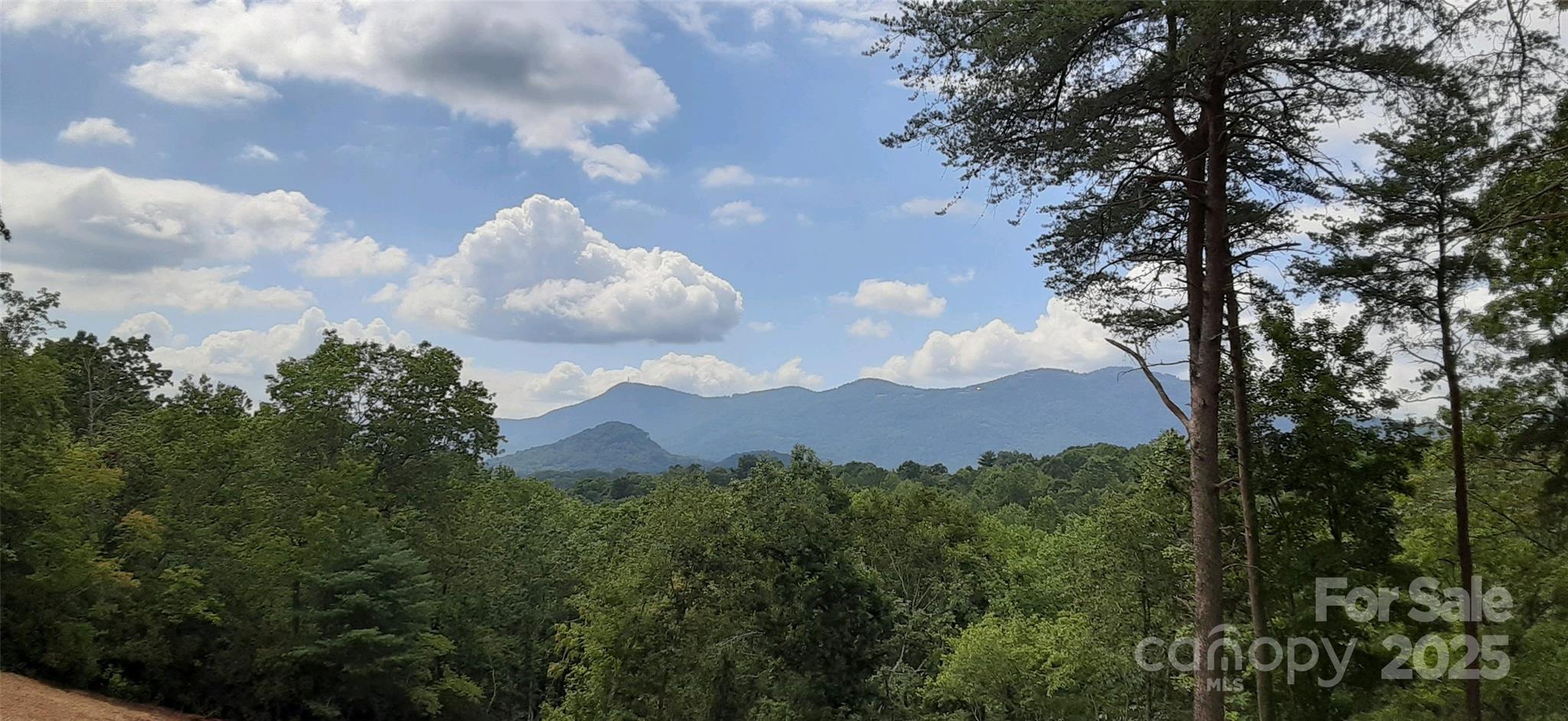 a view of a house in middle of green field