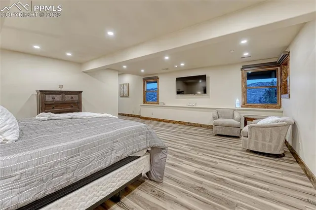 a spacious bedroom with a bed and a couch