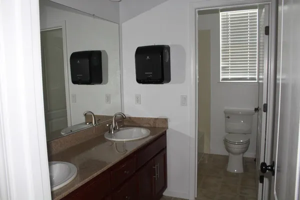 a bathroom with a sink and mirror