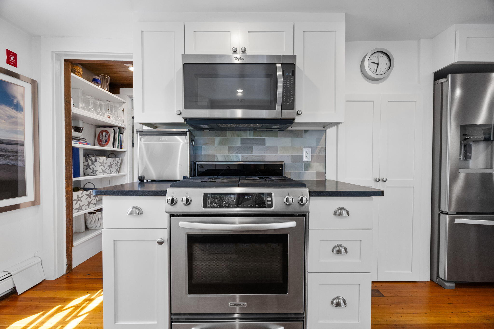 34 Kenwood Road Pocasset, MA 02559 - Photo 16 of 95 a kitchen with stainless steel appliances a stove a microwave and cabinets
