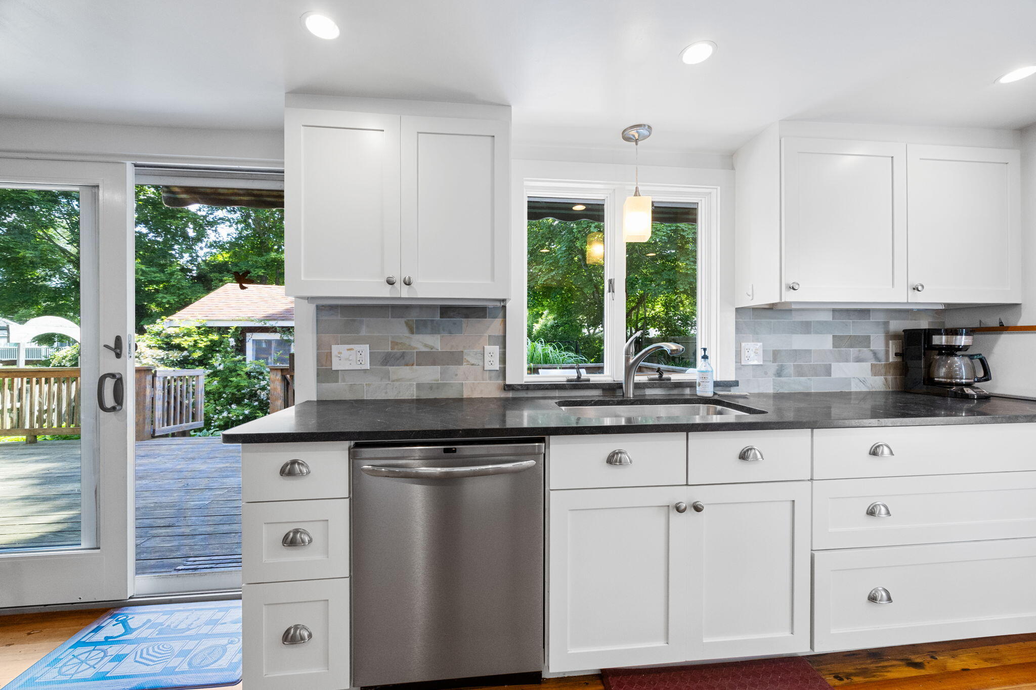 34 Kenwood Road Pocasset, MA 02559 - Photo 17 of 95 a kitchen with granite countertop white cabinets and white appliances with a sink