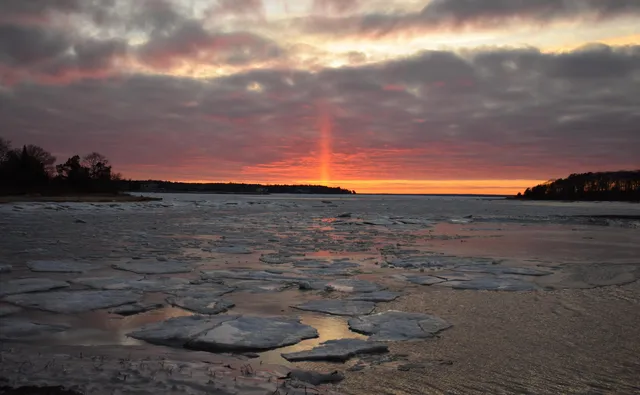an aerial view of a houses with a lake view