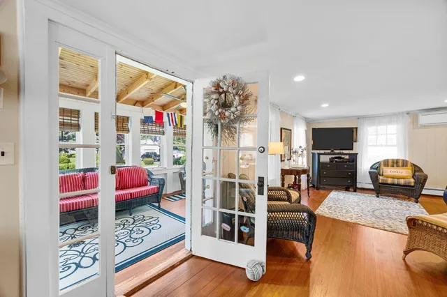 a bedroom with a bed and a dresser in it