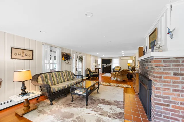 a bedroom with bed and a chair