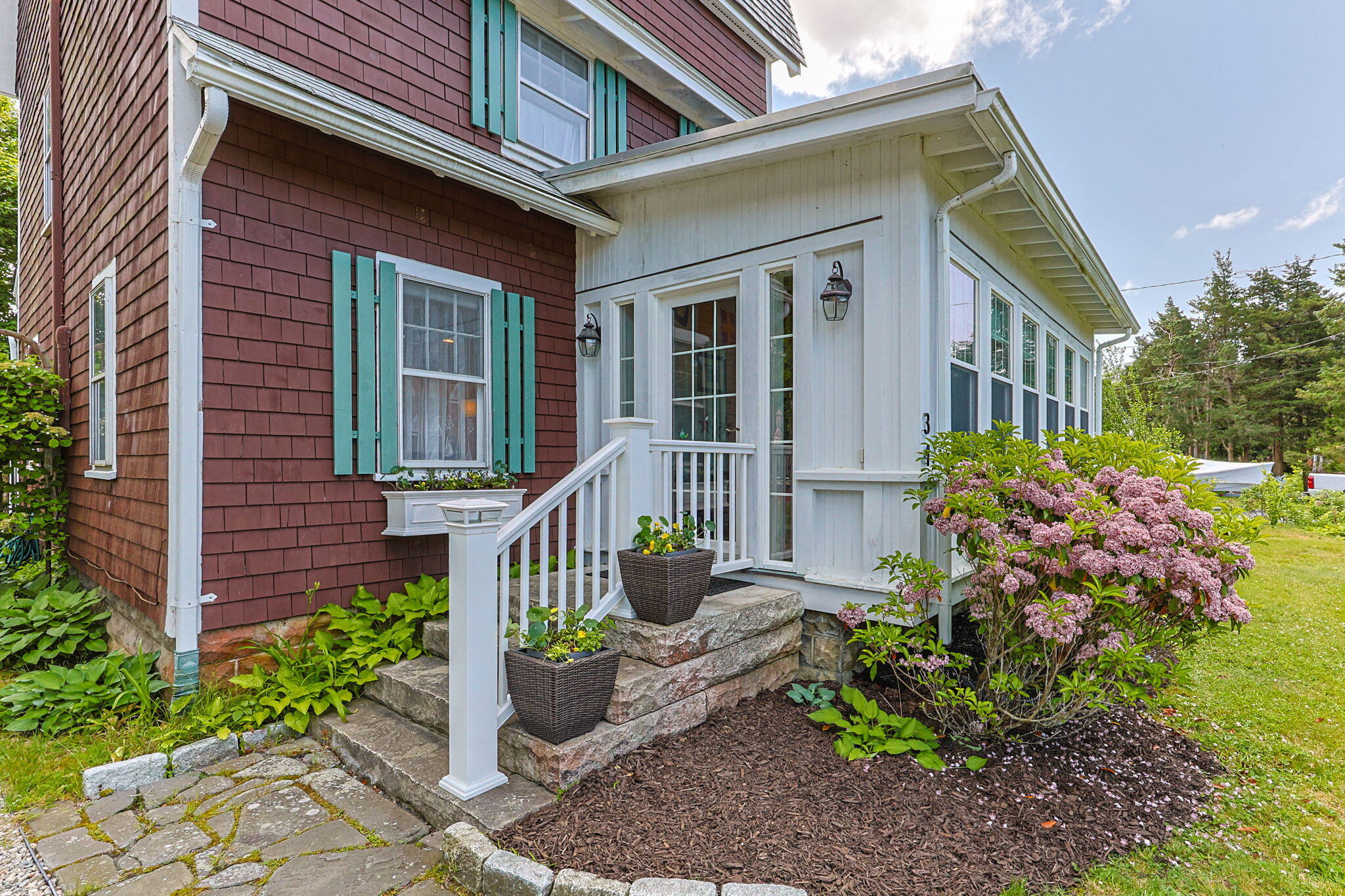34 Kenwood Road Pocasset, MA 02559 - Photo 31 of 95 a front view of a house with garden