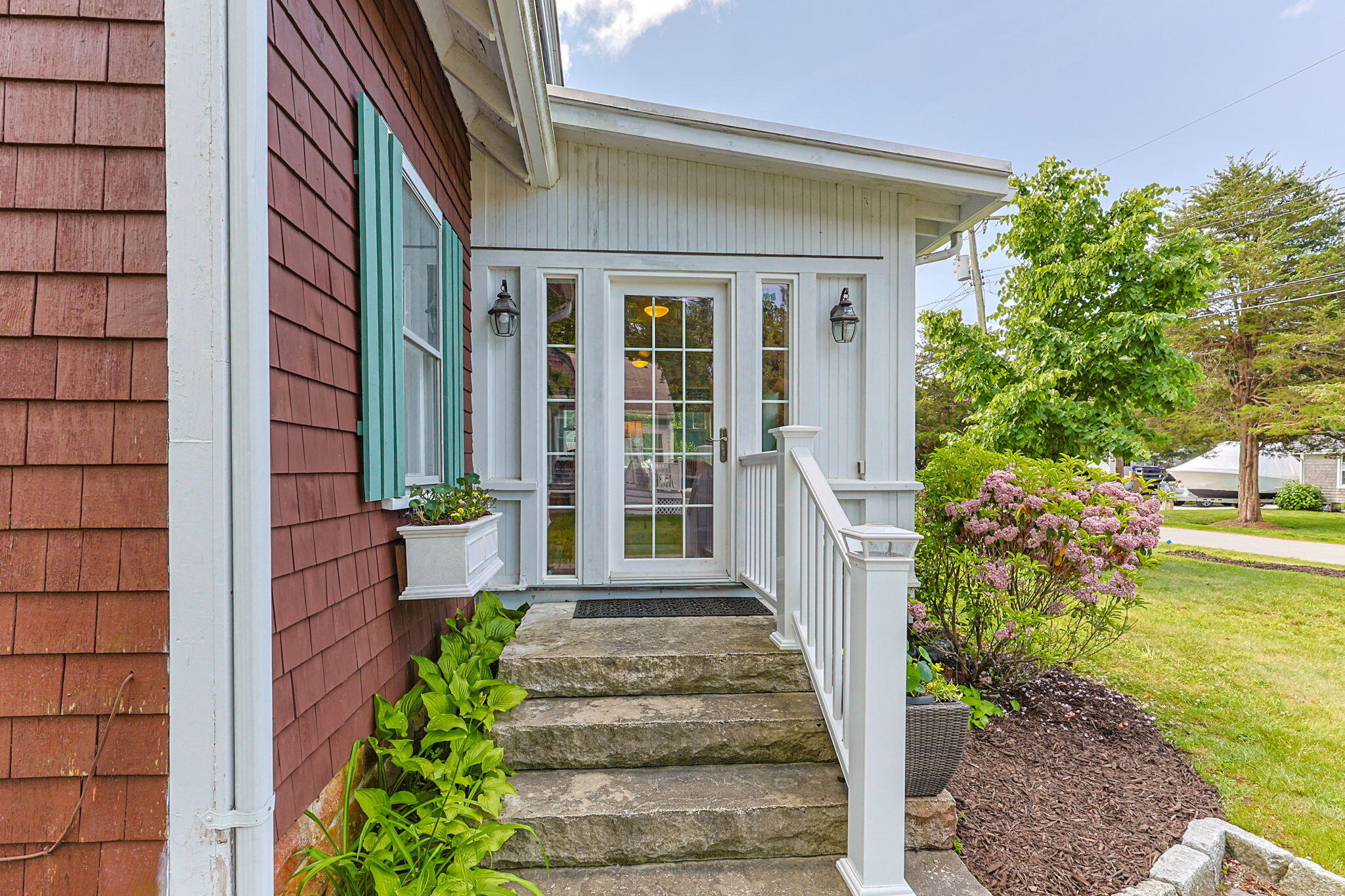 34 Kenwood Road Pocasset, MA 02559 - Photo 32 of 95 a front view of a house with a yard