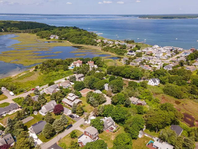 a house that has a big yard and a large tree