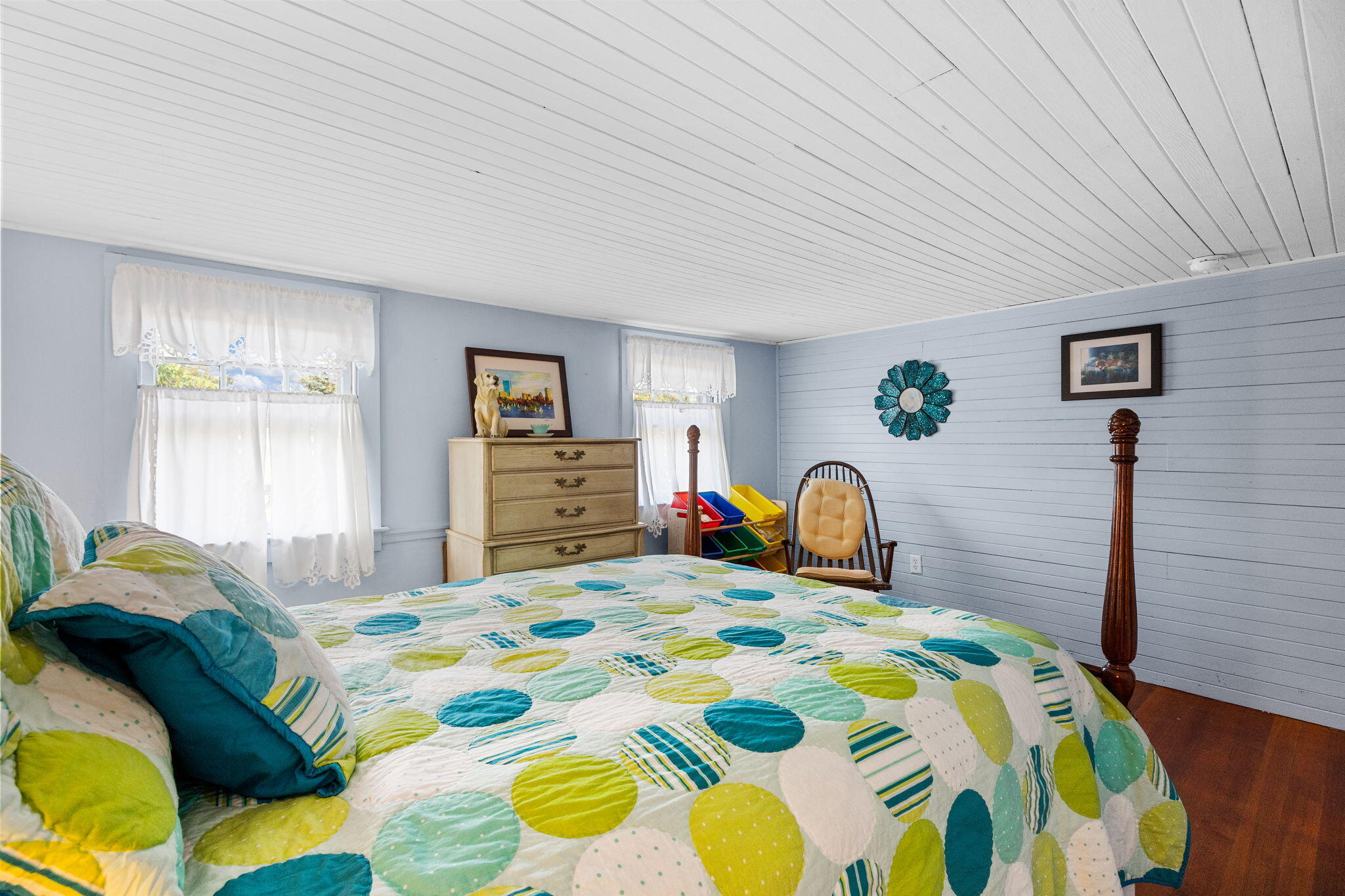 34 Kenwood Road Pocasset, MA 02559 - Photo 41 of 95 a bedroom with a bed and a dresser in it