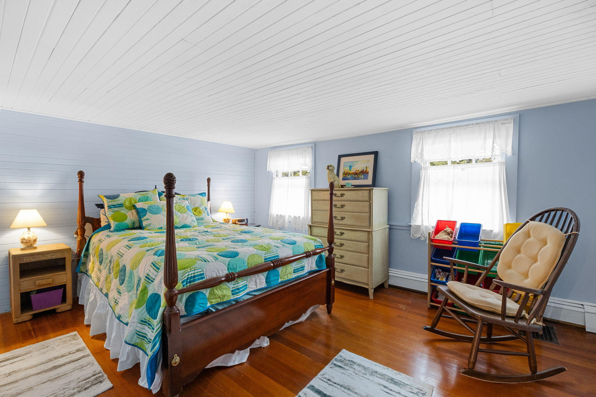 34 Kenwood Road Pocasset, MA 02559 - Photo 42 of 95 a bedroom with bed and a chair