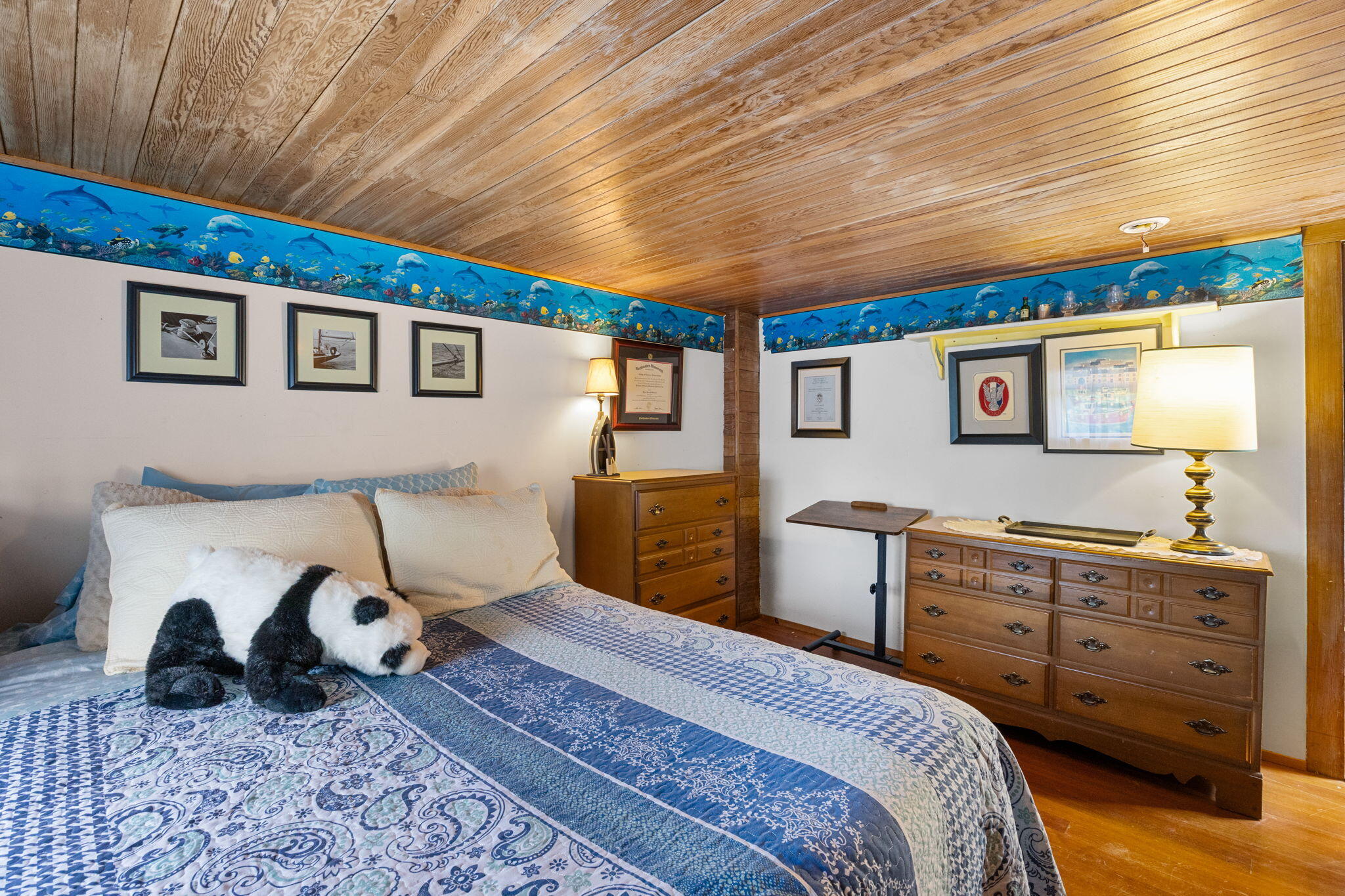 34 Kenwood Road Pocasset, MA 02559 - Photo 45 of 95 a bedroom with a bed and a dresser in it