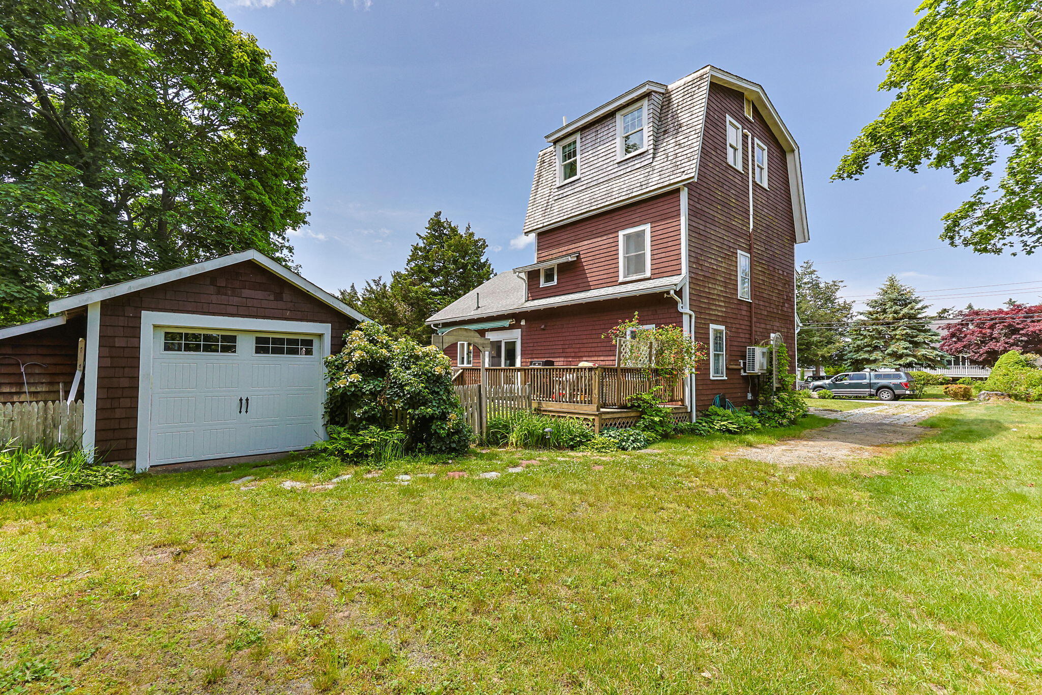 34 Kenwood Road Pocasset, MA 02559 - Photo 55 of 95 a view of a house with a yard and large tree