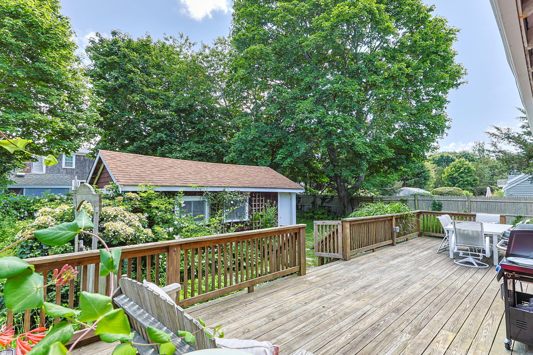 34 Kenwood Road Pocasset, MA 02559 - Photo 61 of 95 a view of a roof deck with wooden floor and fence