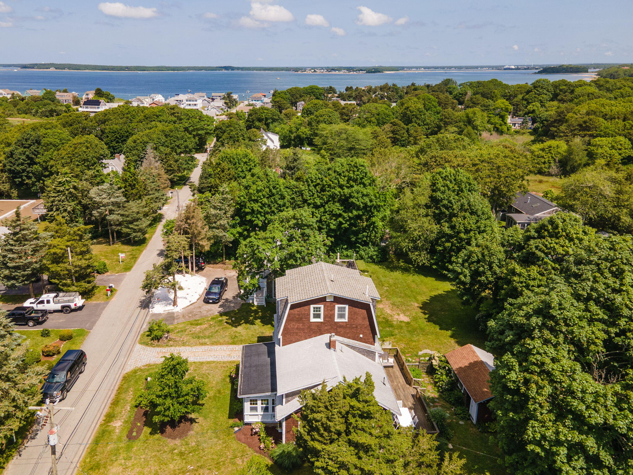 34 Kenwood Road Pocasset, MA 02559 - Photo 69 of 95 an aerial view of a house with a yard and lake view
