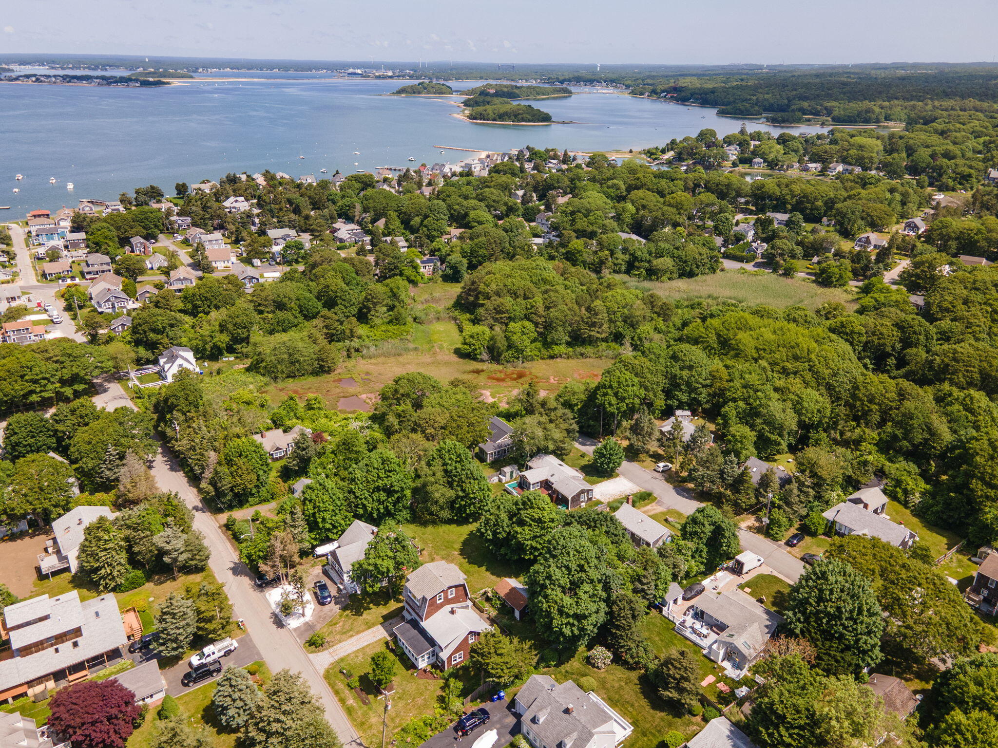 34 Kenwood Road Pocasset, MA 02559 - Photo 7 of 95 an aerial view of a houses with a lake view