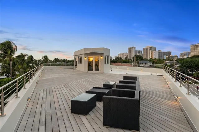 a view of a balcony with wooden floor