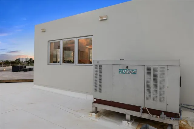 a room with gym equipment and view of living room