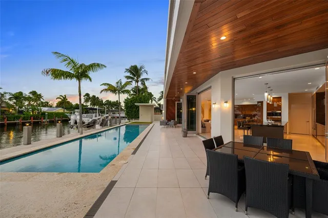 a view of swimming pool with outdoor seating