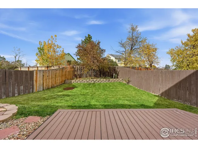 a view of backyard with wooden floor