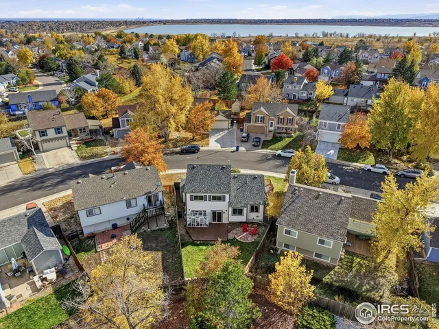 an aerial view of a house with a lake view