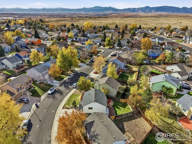 an aerial view of residential building with outdoor space and ocean view