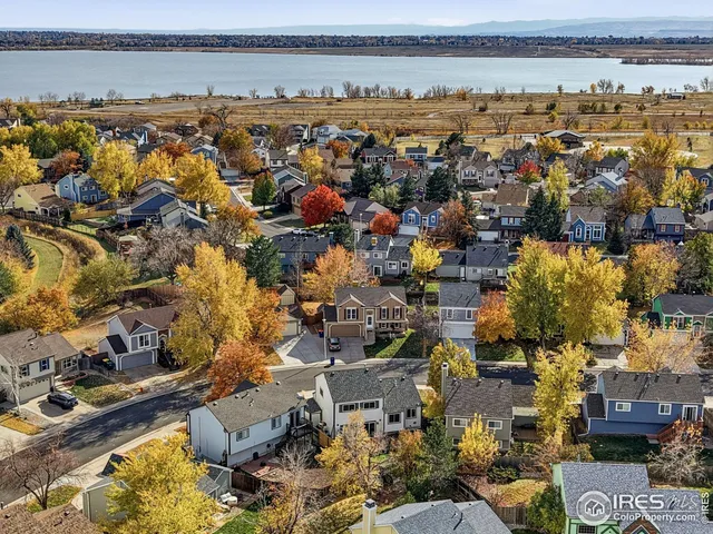 an aerial view of a city with lots of residential buildings and ocean view in ocean
