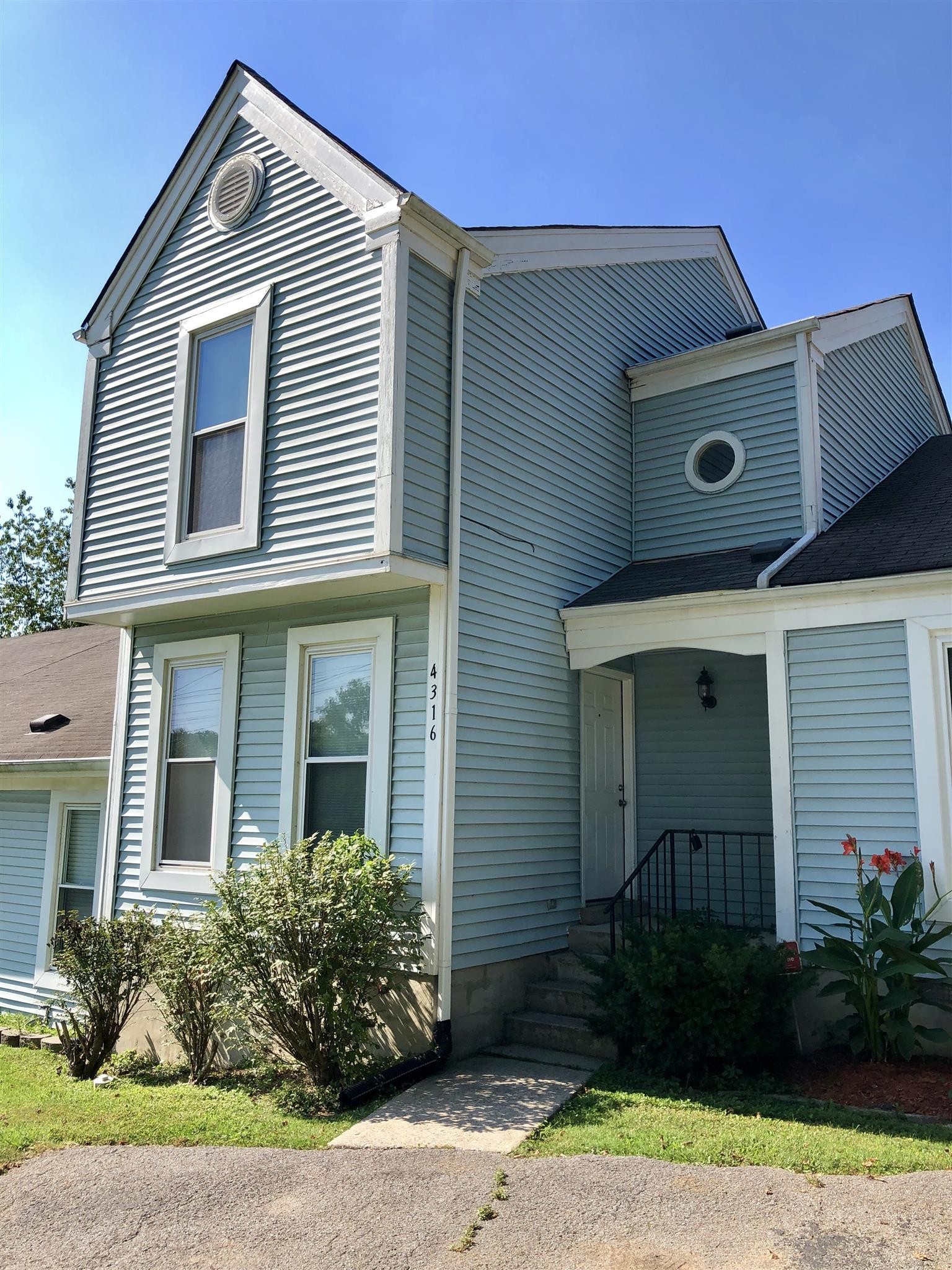 4316 Baton Rouge Drive Hermitage, TN 37076 - Photo 1 of 10 a front view of a house with garden