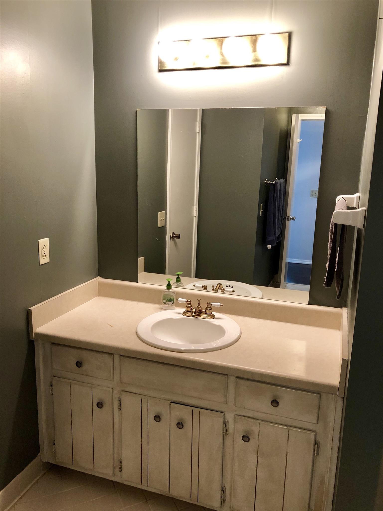 4316 Baton Rouge Drive Hermitage, TN 37076 - Photo 9 of 10 a bathroom with a granite countertop sink and a mirror