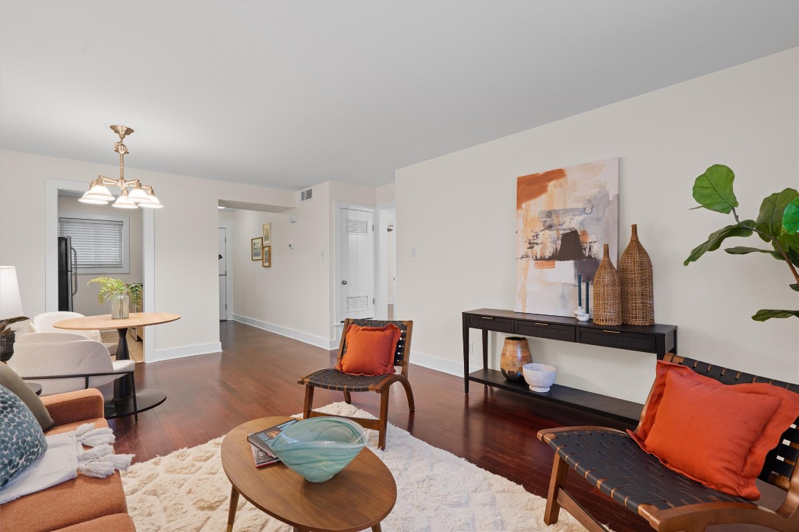 3815 Guadalupe Street, Unit 204 Austin, TX 78751 - Photo 1 of 19 a living room with furniture and wooden floor