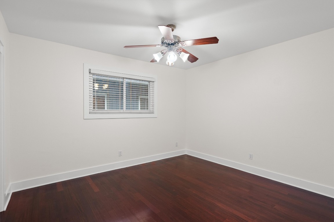 3815 Guadalupe Street, Unit 204 Austin, TX 78751 - Photo 13 of 19 a view of an empty room with wooden floor and a window