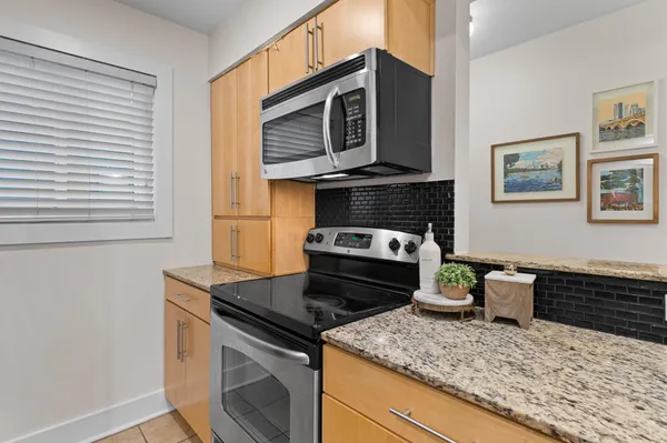 a kitchen with a stove and a microwave