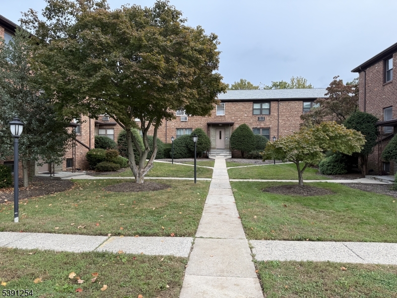 799 Mountain Avenue, Unit D Springfield, NJ 07081 - Photo 1 of 16 front view of a house with a yard