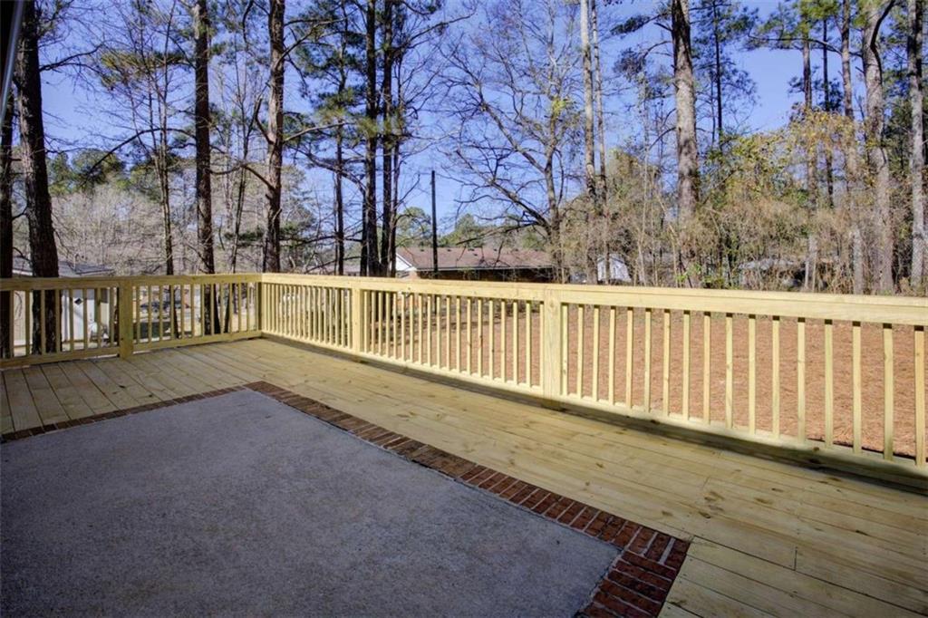 7225 Pineneedle Drive Southwest Covington, GA 30014 - Photo 30 of 37 a view of a balcony with trees
