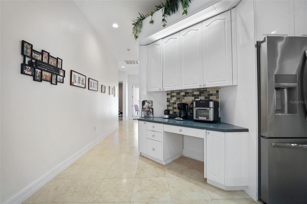 14423 Kandi Court Largo, FL 33774 - Photo 11 of 75 a kitchen with stainless steel appliances a refrigerator and a stove