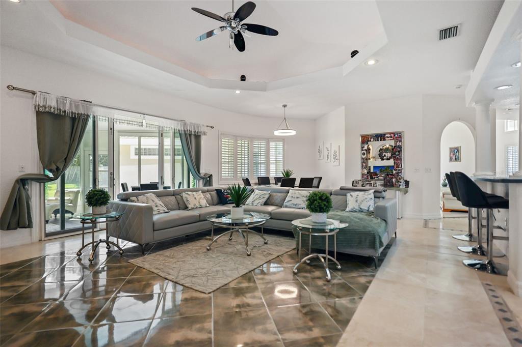 14423 Kandi Court Largo, FL 33774 - Photo 18 of 75 a living room with furniture and a large window