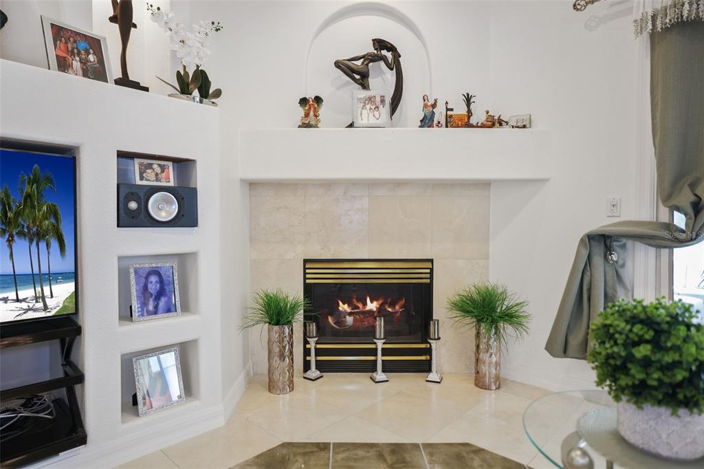 14423 Kandi Court Largo, FL 33774 - Photo 21 of 75 a living room with furniture and a fireplace