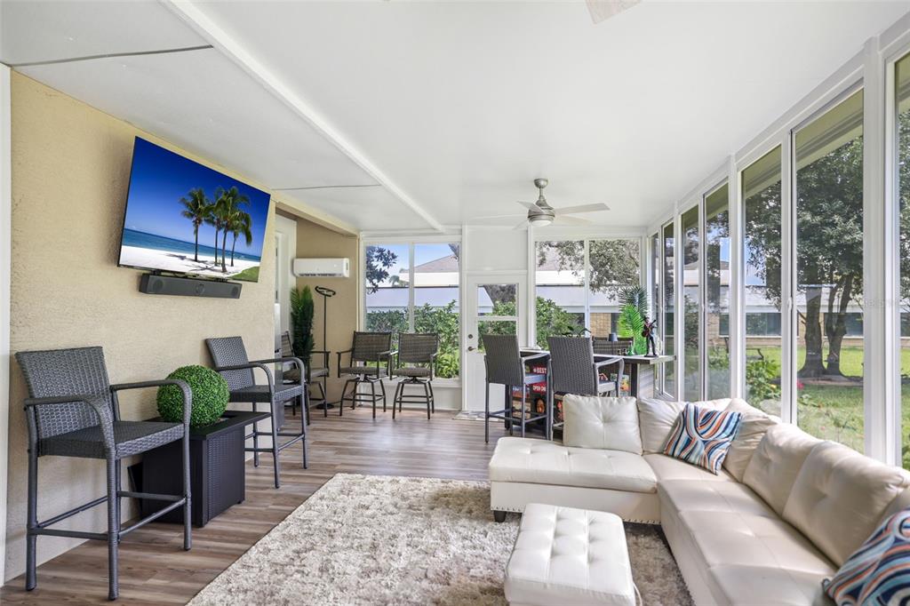 14423 Kandi Court Largo, FL 33774 - Photo 25 of 75 a living room with furniture and a large window