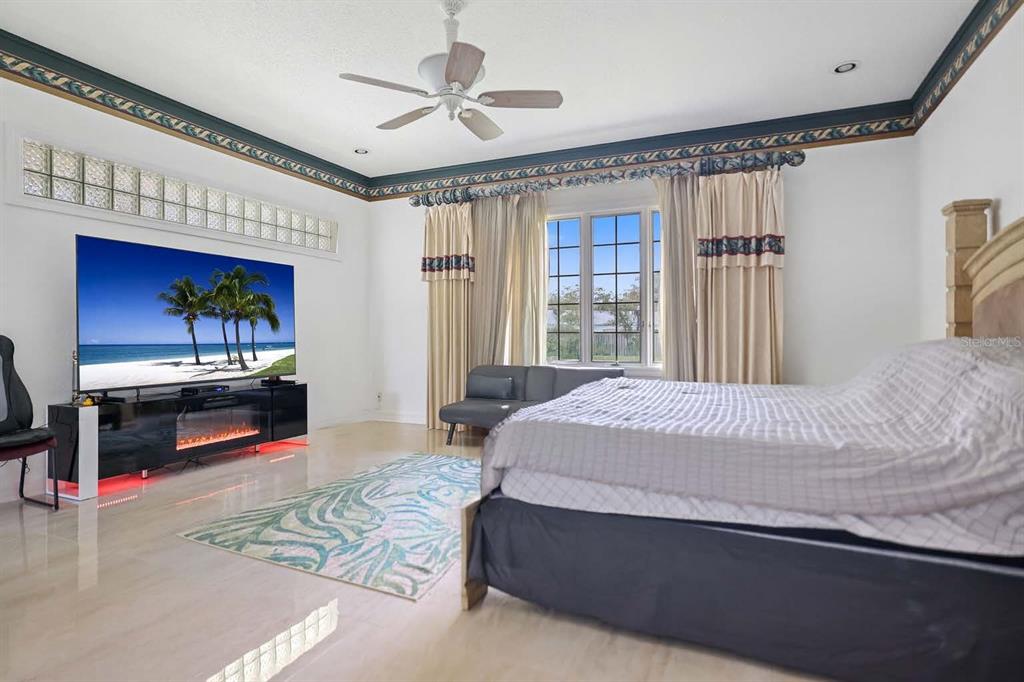 14423 Kandi Court Largo, FL 33774 - Photo 30 of 75 a bedroom with a bed and a flat screen tv