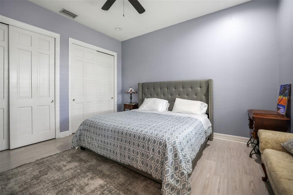 14423 Kandi Court Largo, FL 33774 - Photo 36 of 75 a bedroom with a bed and wooden floor