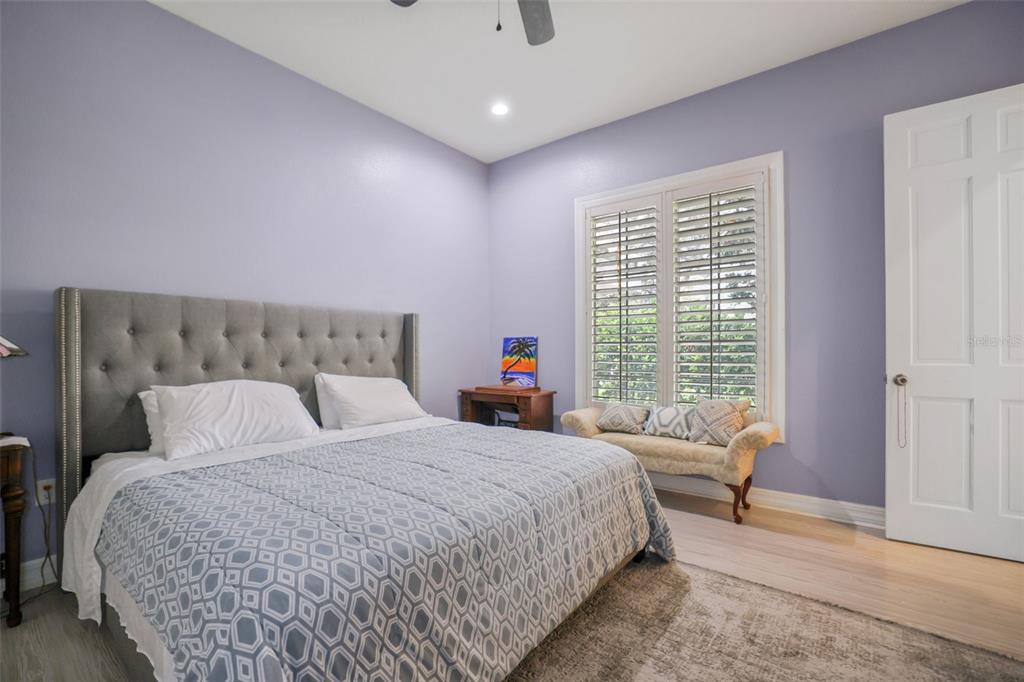 14423 Kandi Court Largo, FL 33774 - Photo 37 of 75 a bedroom with a large bed and a large window